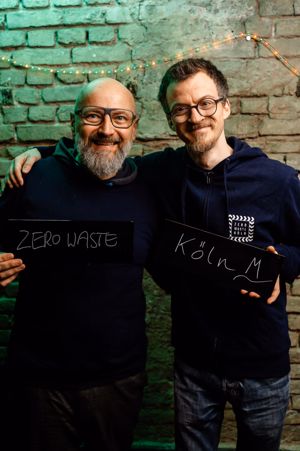 Colabor Neujahrsplausch Michael und Jan mit Kreidetafeln auf denen Zero Waste Köln steht